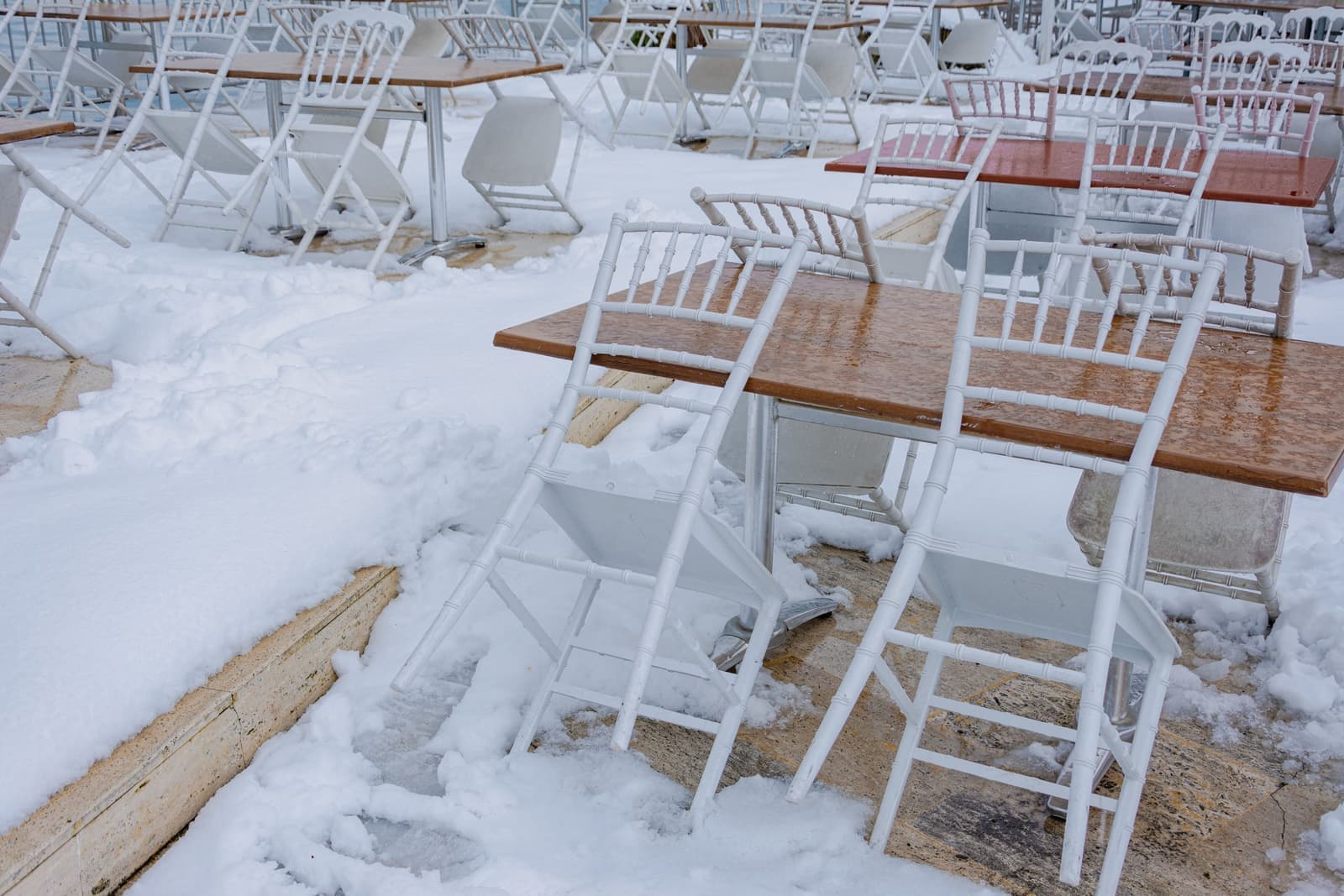 Outdoor furniture protected under a fitted cover