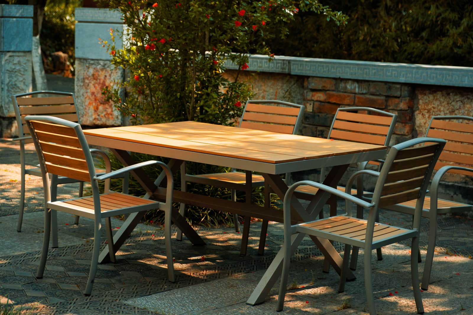 An outdoor dining table set for a meal on a patio