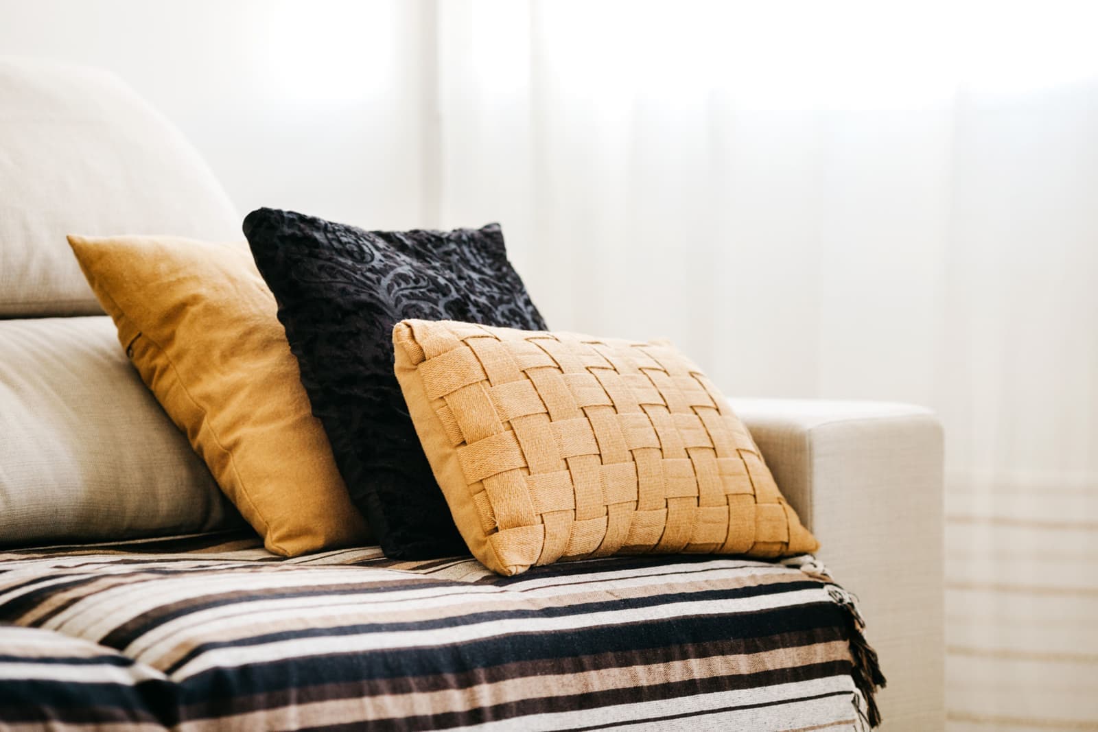 Solution-dyed acrylic outdoor cushions in soft tones